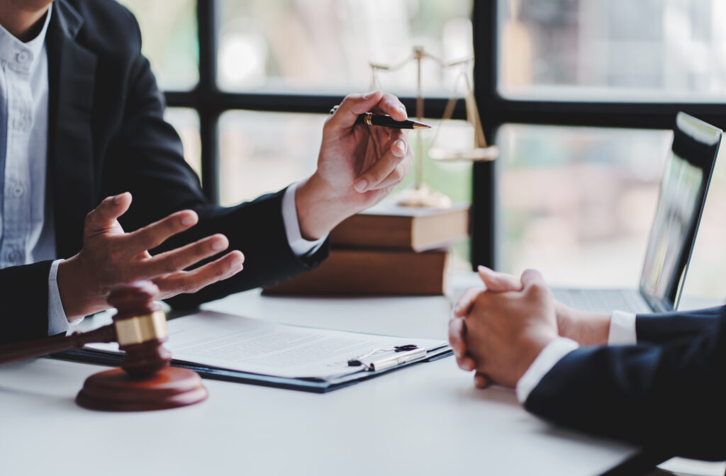 Attorney discussing legal documents with a client