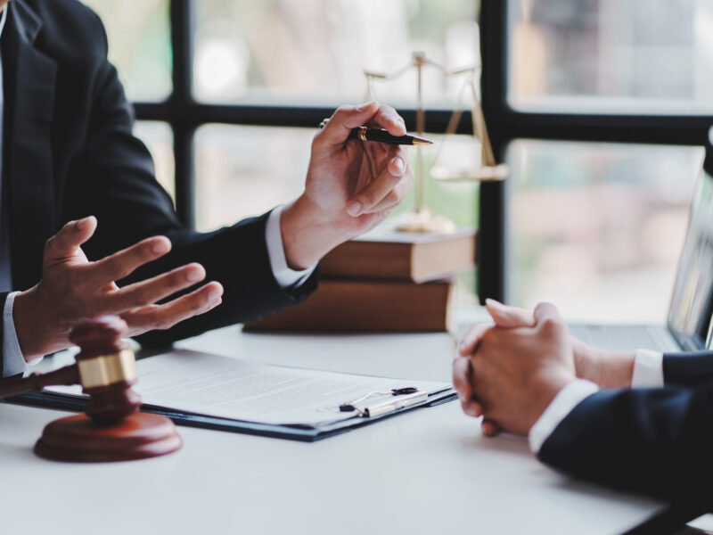 Attorney discussing legal documents with a client
