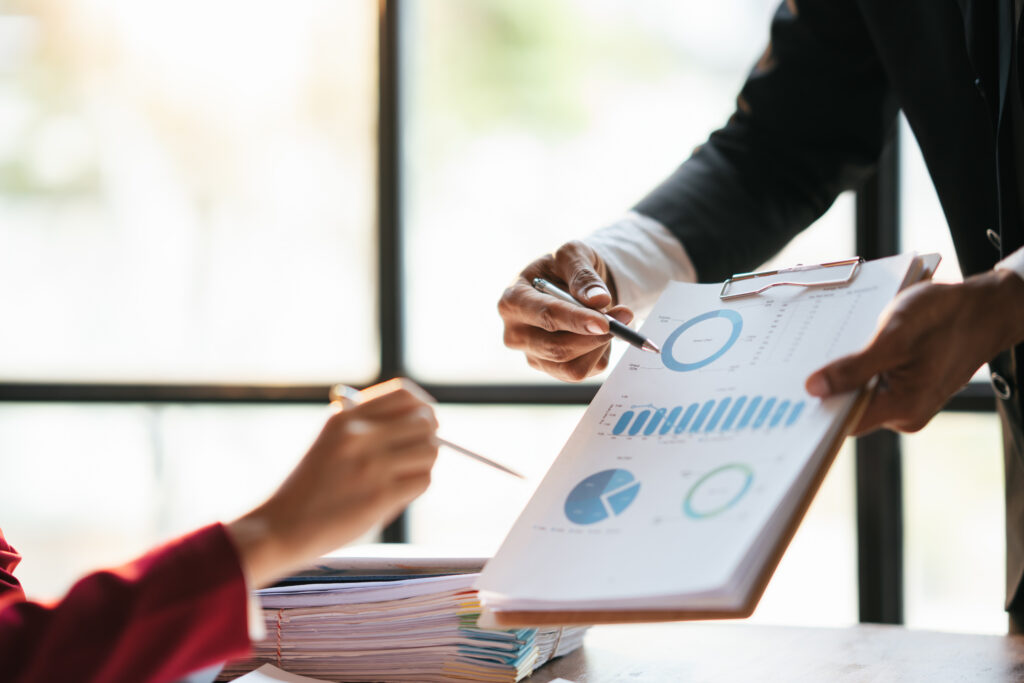 Professionals reviewing financial charts during a business meeting