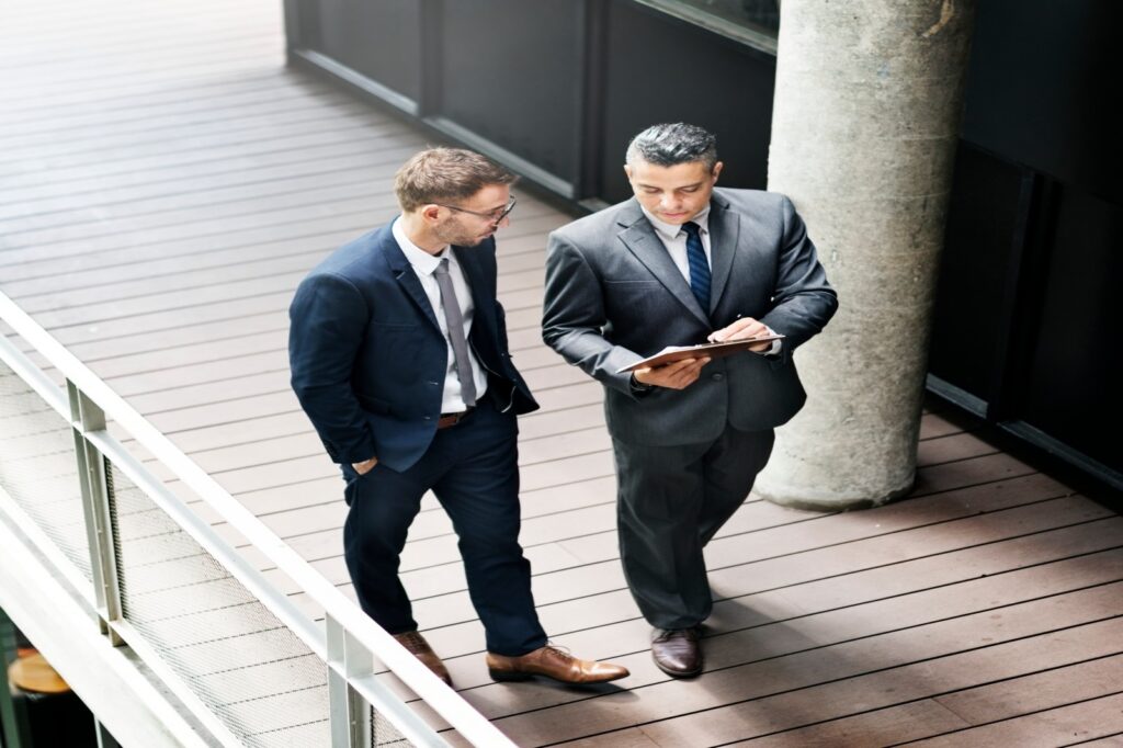 Two businessmen discussing about Challenges
