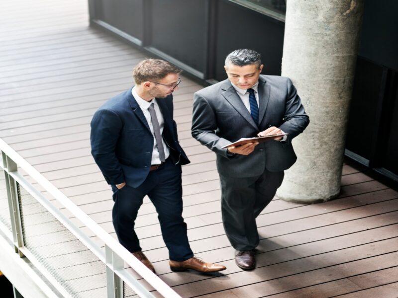 Two businessmen discussing about Challenges