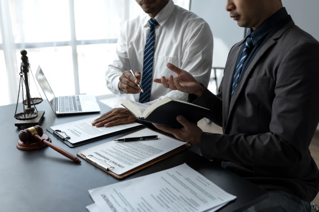 Serious Businessmen Reviewing Contracts in Office